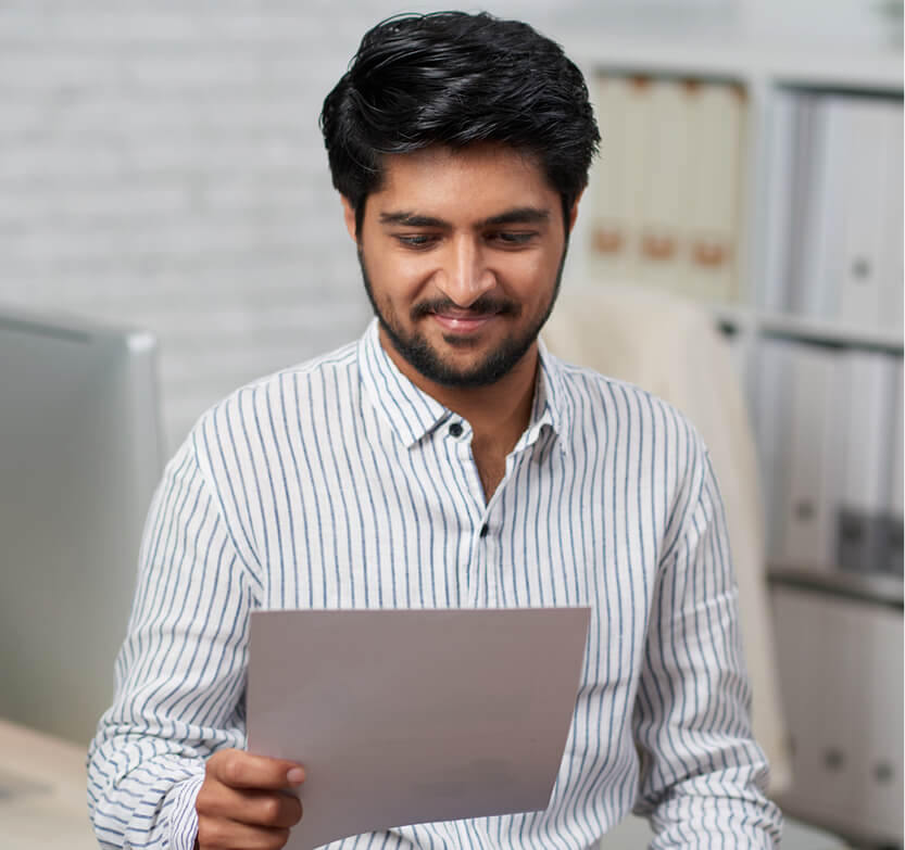 happy-person-with-papers-in-hand-1